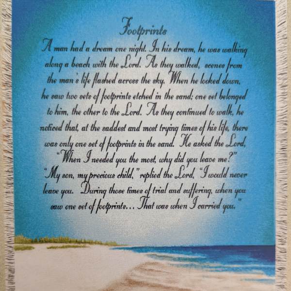 Fringed wall hanging with a beach scene and printed poem text