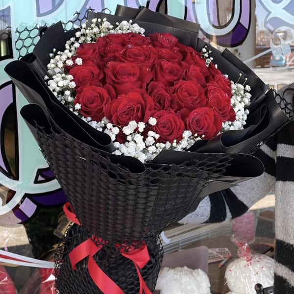 Red Roses Wrapped In Black Paper