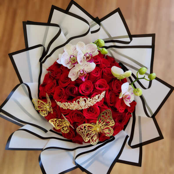 Red rose bouquet with white orchids and gold butterfly accents