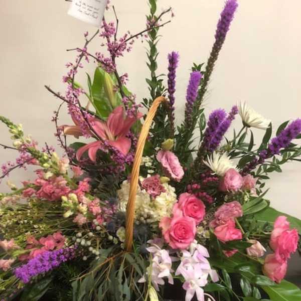 Large mixed floral basket with pink and purple blooms