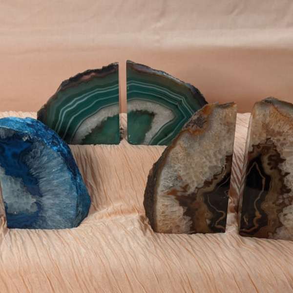Three pairs of polished agate bookends in blue, green, and brown tones