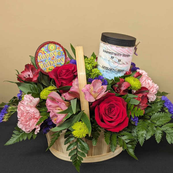 Birthday flower basket with roses, alstroemeria, and a body butter jar