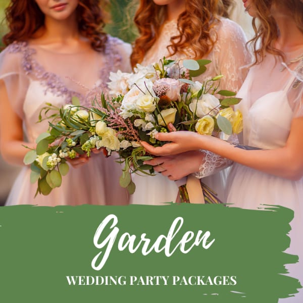 Bridesmaids holding pastel wedding bouquets with roses and greenery
