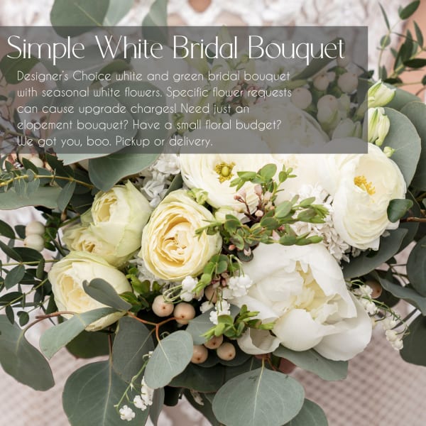 White bridal bouquet with cream roses and white blooms