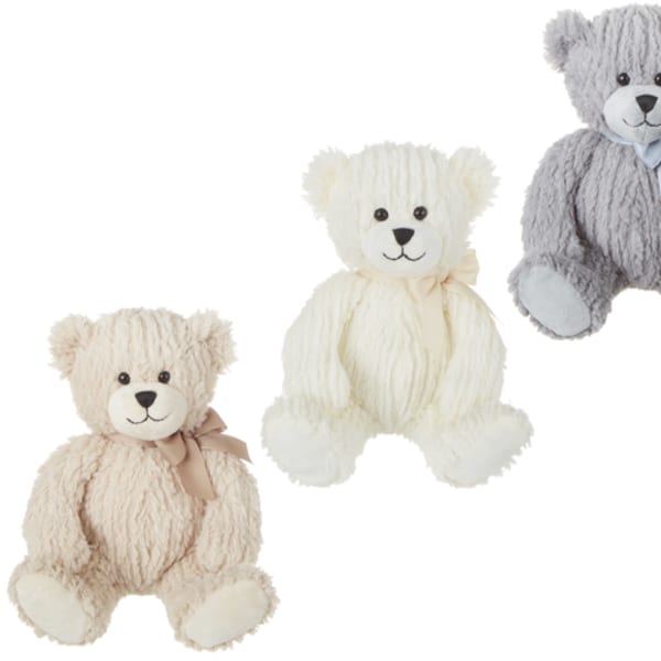 Three plush teddy bears in cream, white, and gray with ribbons