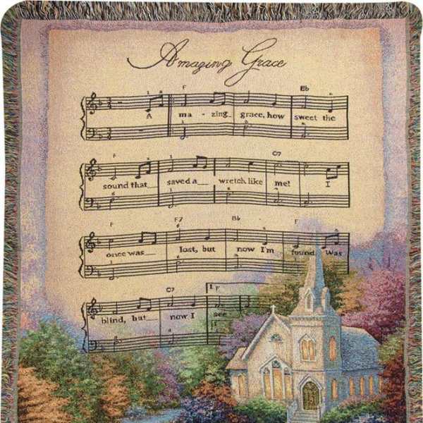 Decorative throw blanket with hymn lyrics and a church scene