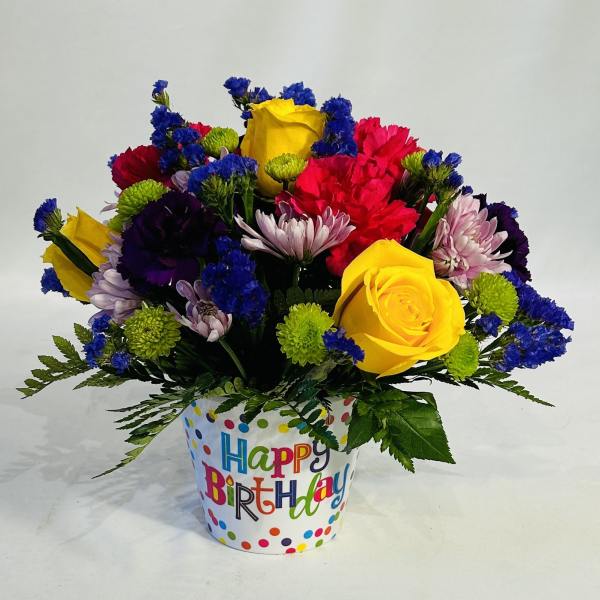 Colorful mixed flower bouquet in a birthday pot