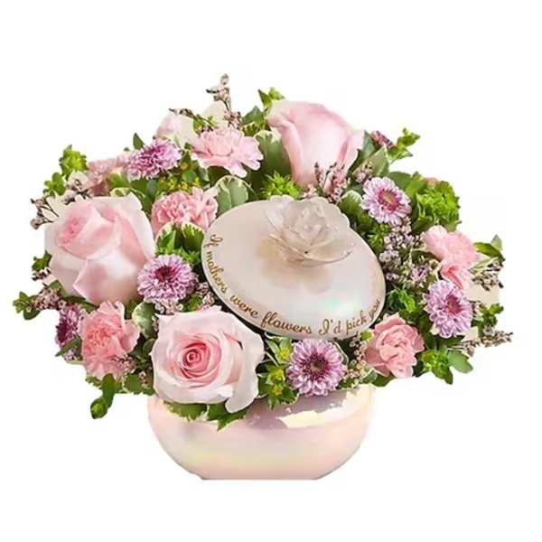 Pink roses and small purple flowers arranged in a round box with a lid