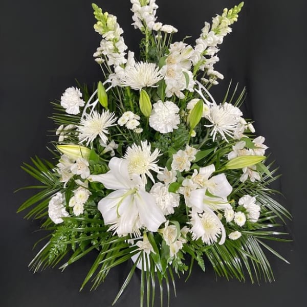 White floral spray with lilies and tall snapdragons