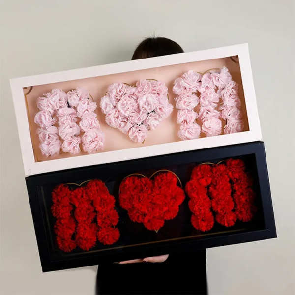 Heart-shaped floral boxes with pink and red flowers