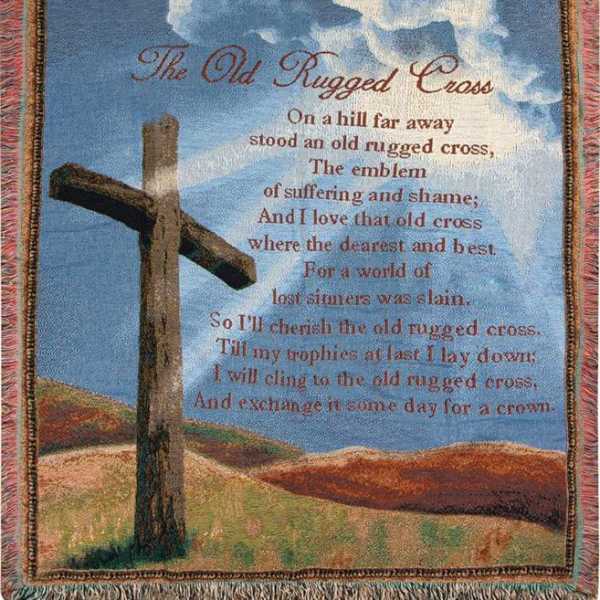 Tapestry with a wooden cross and printed poem against a blue sky