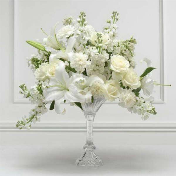 White floral arrangement in a clear glass vase