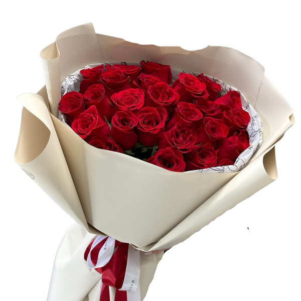 Bouquet of red roses wrapped in cream paper with a red ribbon