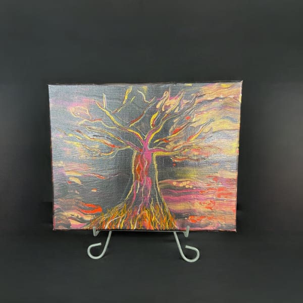 Abstract painting of a tree on a small display easel