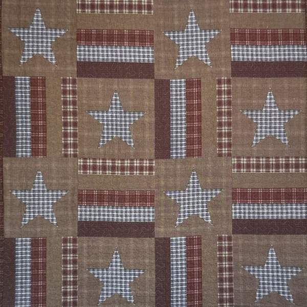 Patchwork quilt with stars and plaid squares in red, tan, and blue