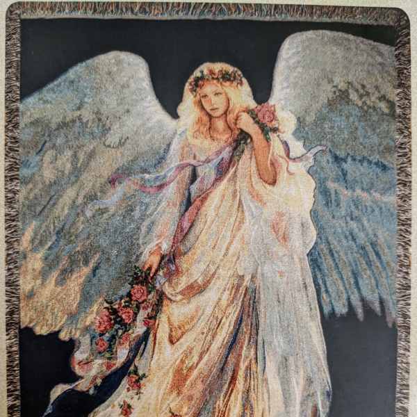 Tapestry of an angel in a flowing dress holding flowers