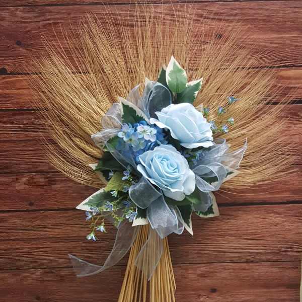 Blue rose bouquet with ribbon and dried grass fan