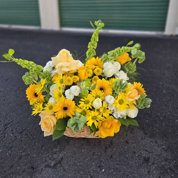Yellow and cream flower basket with roses and daisies