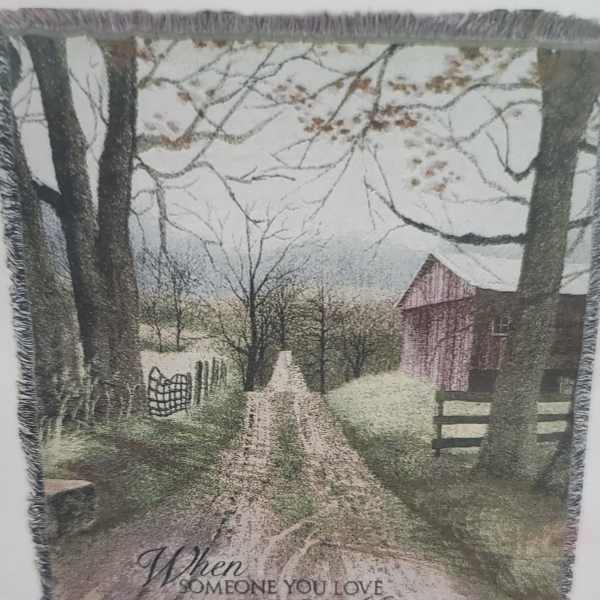 Fringed throw blanket with a rustic barn and memorial quote