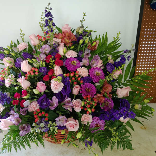 Large mixed flower basket with pink, purple, and red blooms