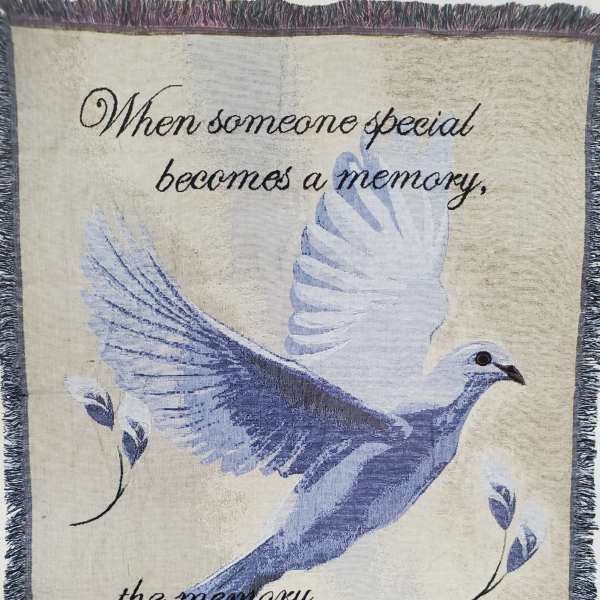 Decorative blanket with a dove and memorial quote
