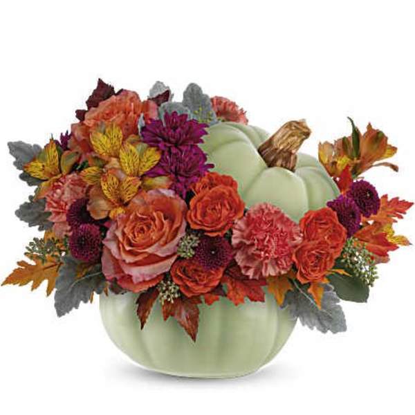 Pumpkin-shaped vase with orange and purple flowers