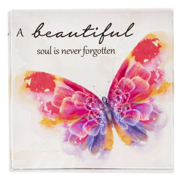 Decorative plaque with a colorful butterfly and memorial text