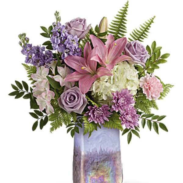 Pink lilies and lavender roses in a tall iridescent vase