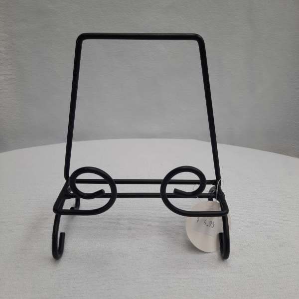 Black metal display stand with a price tag
