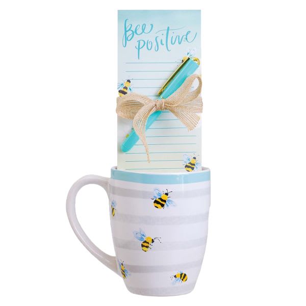 Bee-themed mug with a notepad and pen tied on top