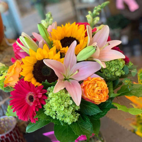 Bouquet with sunflowers, pink lilies, and orange roses