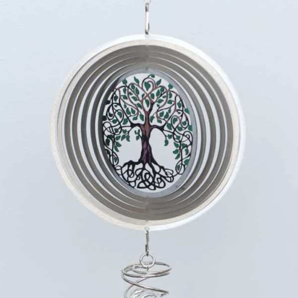 Hanging metal wind spinner with a tree design and crystal pendants