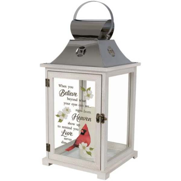 Decorative white lantern with a cardinal and memorial text on the glass