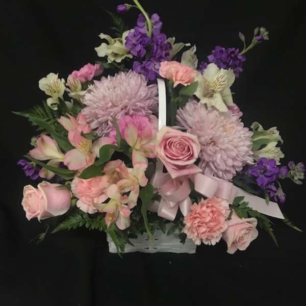 Pink and purple mixed flower basket with roses and chrysanthemums