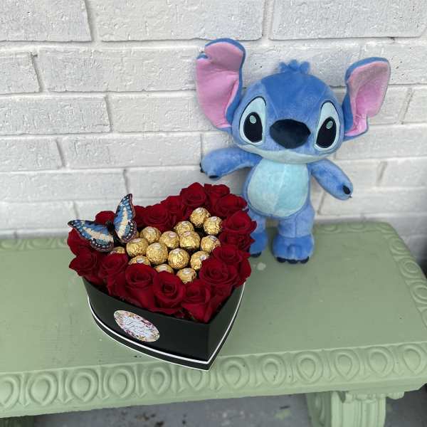Heart-shaped box of red roses with chocolates and a plush Stitch toy