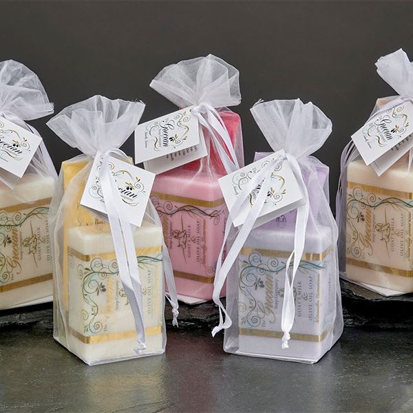 Assorted square candles in sheer gift bags with ribbon tags