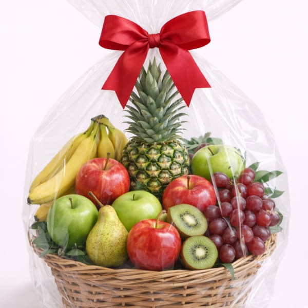 Fruit basket with bananas, apples, grapes, pineapple, pear, and kiwi wrapped in cellophane