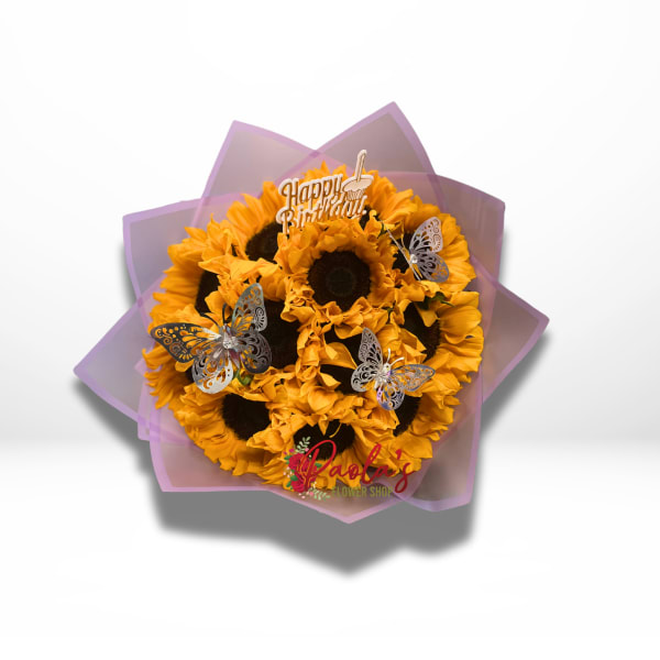 Bouquet of yellow sunflowers with butterfly picks and a birthday topper