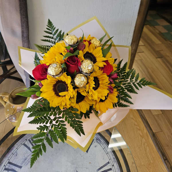 bouquet of sunflowers, chocolates, and red roses