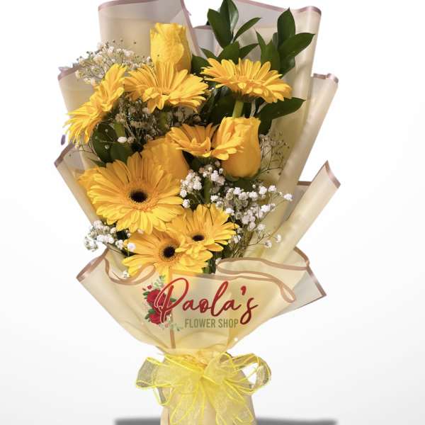 Yellow gerbera bouquet wrapped in cream paper with a yellow ribbon