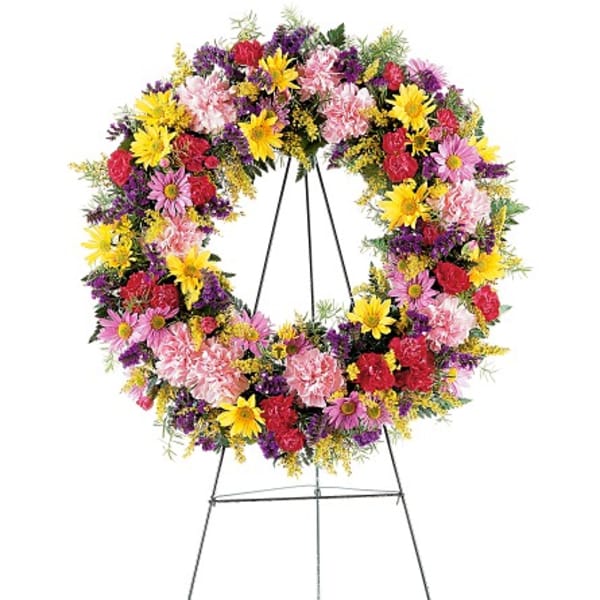 Colorful mixed flower wreath on a standing easel