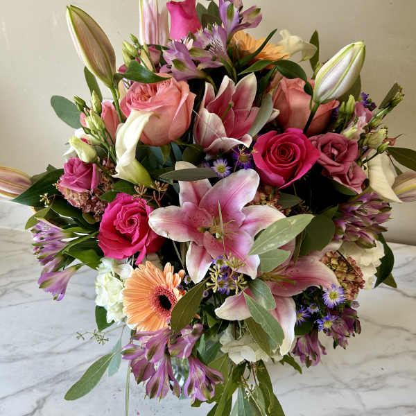 Mixed bouquet with pink lilies, roses, and gerbera daisies