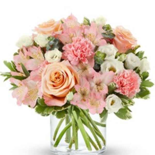 Pink and peach bouquet in a clear glass vase