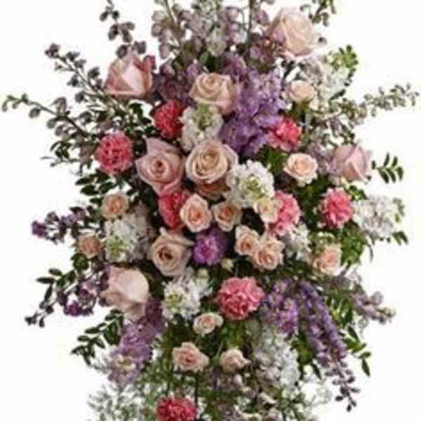 Tall standing floral spray with pink and lavender roses