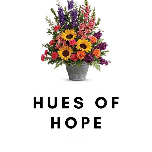 Colorful mixed flower arrangement in a gray pot with "HUES OF HOPE" text below