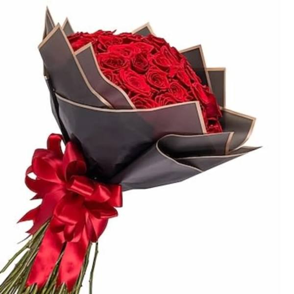 Bouquet of red roses wrapped in dark paper with a red ribbon
