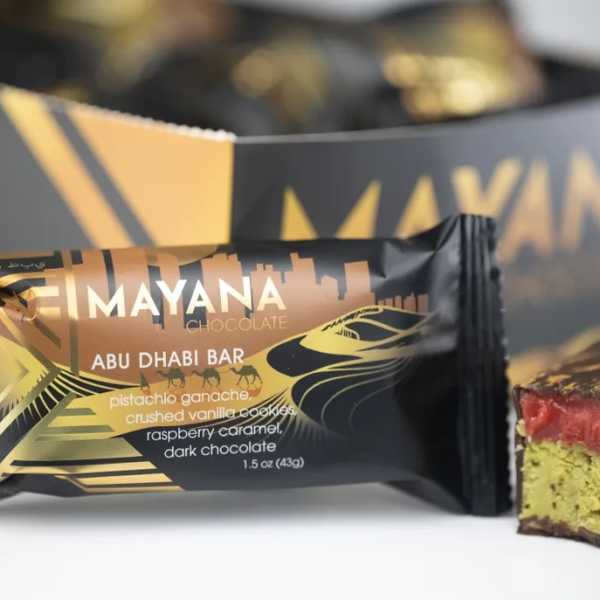 Chocolate bar wrapper with a cut piece showing layered filling