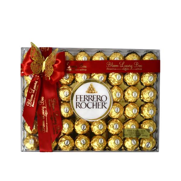 Box of Ferrero Rocher chocolates tied with a red ribbon and butterfly decoration