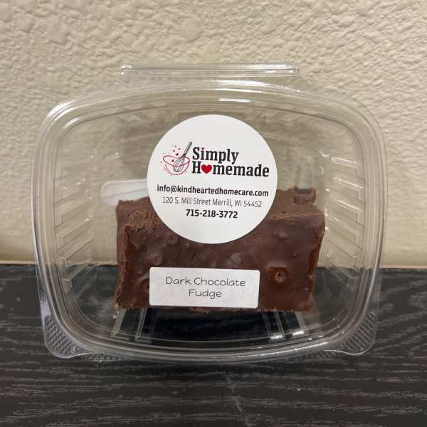 Container of dark chocolate fudge with a label
