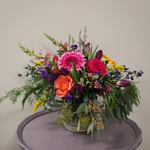 Colorful mixed bouquet in a clear glass vase